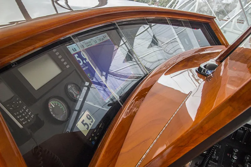 Slide: The Image of Control panel of a 2000 Merritt 80' Sportfish boat with navigation instruments. - 22