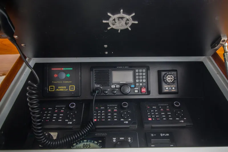 Slide: The Image of Control panel of a 2000 Merritt 80' Sportfish boat with communication equipment. - 24