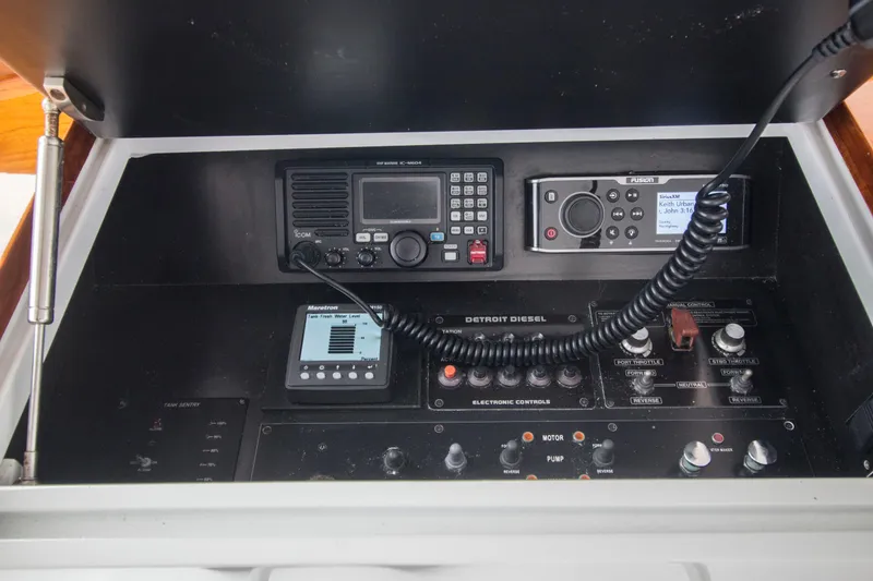 Slide: The Image of Control panel of a 2000 Merritt 80' Sportfish boat with communication and navigation equipment. - 25