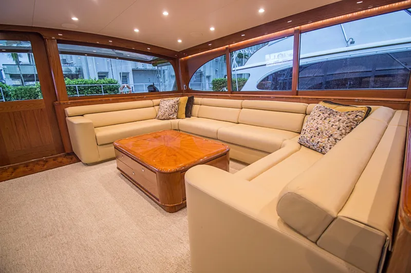 Slide: The Image of Luxurious Merritt 80' Sportfish 2000 yacht interior with beige leather seating and wooden accents. - 28