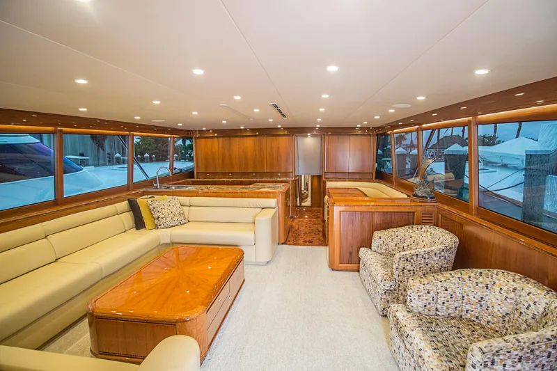 Slide: The Image of Luxurious interior of a 2000 Merritt 80' Sportfish yacht with elegant seating and wood finishes. - 30