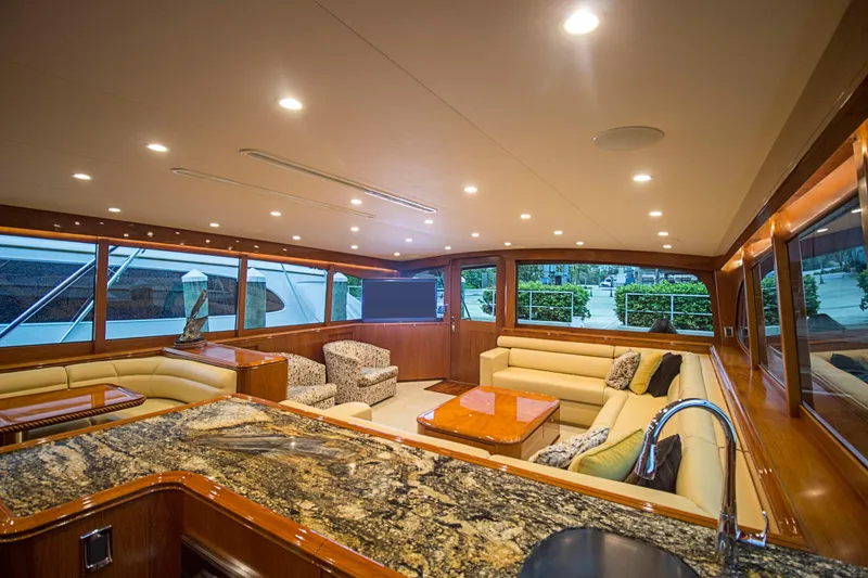 Slide: The Image of Luxurious interior of 2000 Merritt 80' Sportfish yacht with elegant seating and granite countertops. - 31