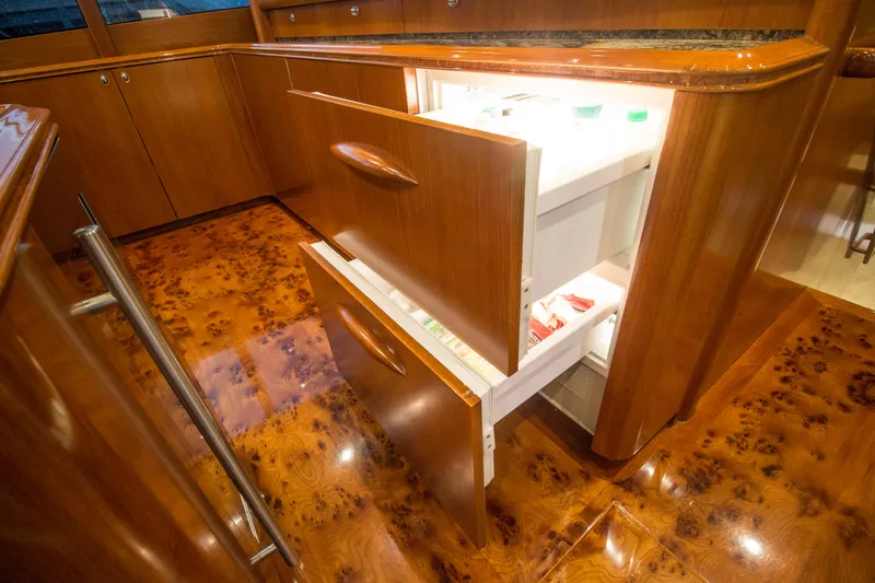 Slide: The Image of Luxurious wooden kitchen interior on 2000 Merritt 80' Sportfish yacht. - 35