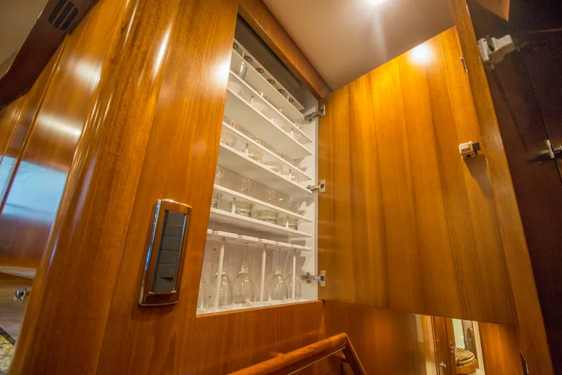 Slide: The Image of Luxurious wooden cabinet with glassware inside Merritt 80' Sportfish yacht, 2000 model. - 37
