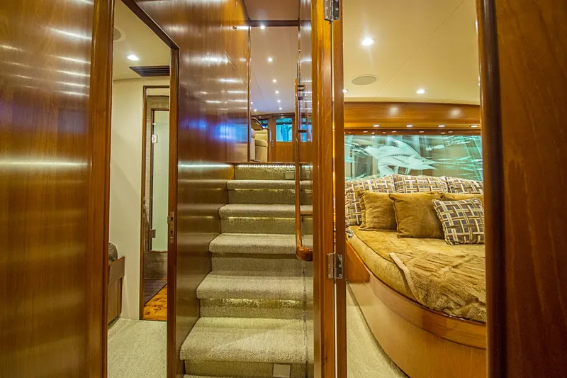 Slide: The Image of Luxurious interior of 2000 Merritt 80' Sportfish yacht with plush seating and elegant wood finishes. - 40
