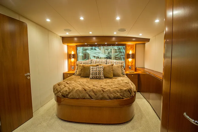 Slide: The Image of Luxurious bedroom interior of 2000 Merritt 80' Sportfish yacht with elegant wood finishes. - 42