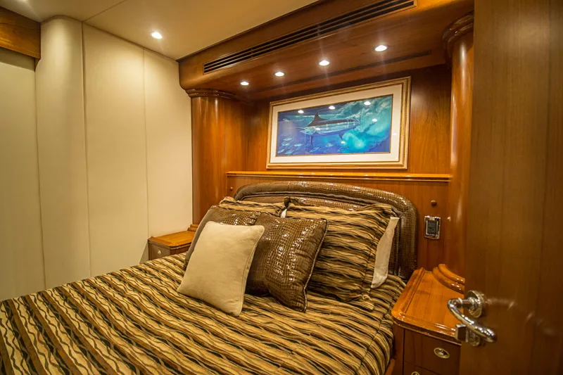 Slide: The Image of Luxurious cabin interior of 2000 Merritt 80' Sportfish yacht with elegant bedding and artwork. - 47