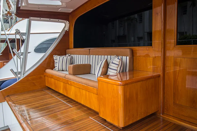Slide: The Image of Luxurious wooden deck seating on a 2000 Merritt 80' Sportfish yacht. - 7