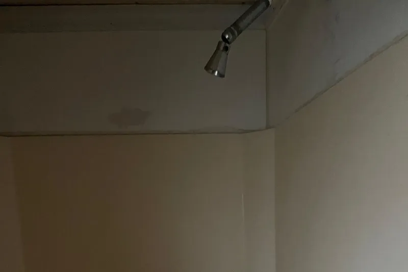 Slide: The Image of Ceiling-mounted showerhead in a 1986 Waterhouse 14 X 44 houseboat bathroom. - 11