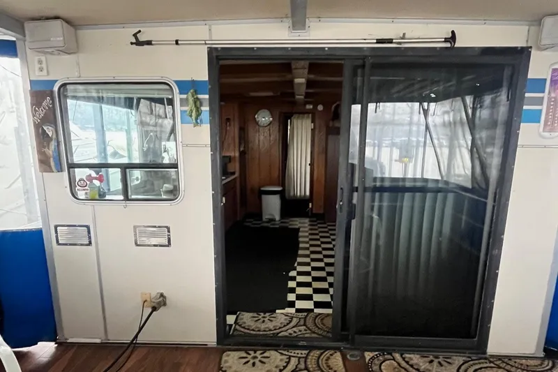 Slide: The Image of Interior view of a 1986 Waterhouse 14 X 44 houseboat with sliding glass door. - 5