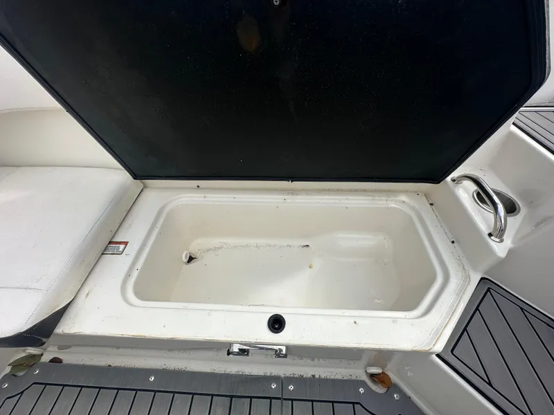 Slide: The Image of Open storage compartment on a 2021 Sea Ray SPX 190 OB boat. - 13