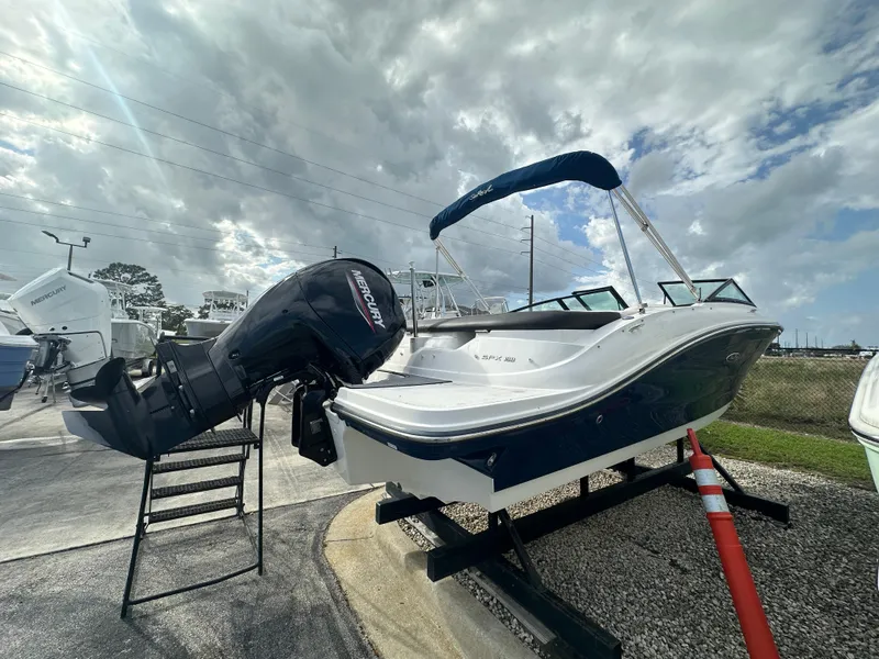 Slide: The Image of 2021 Sea Ray SPX 190 OB boat with outboard motor on display under cloudy sky. - 3