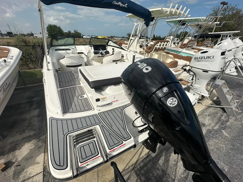 Slide: The Image of 2021 Sea Ray SPX 190 OB boat with outboard motor, docked in a marina. - 4