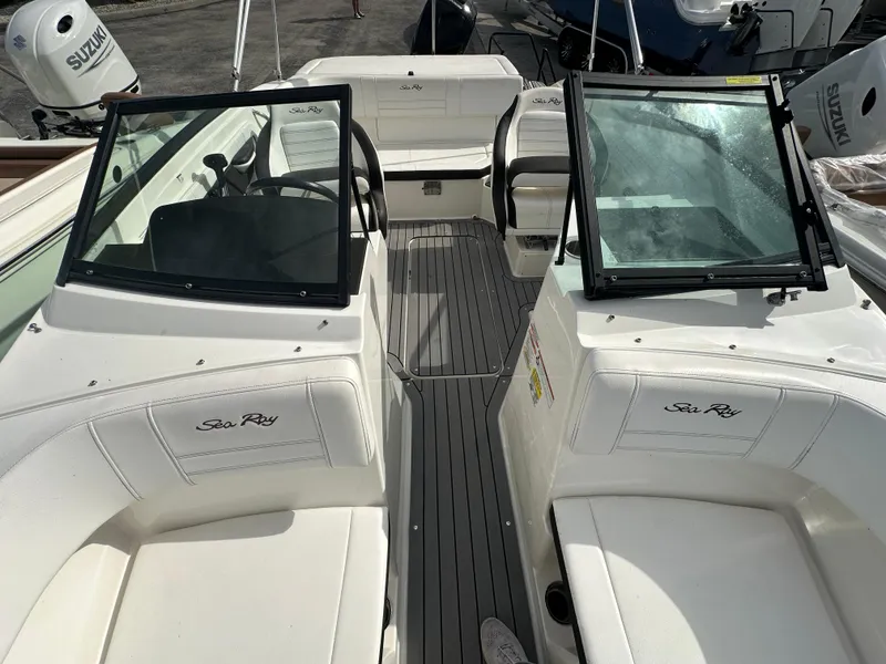 Slide: The Image of 2021 Sea Ray SPX 190 OB boat interior with seating and windshield. - 9