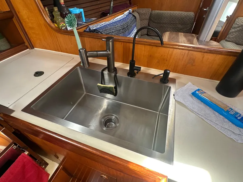 Slide: The Image of Stainless steel sink in 1986 Beneteau First 375 yacht kitchen interior. - 14