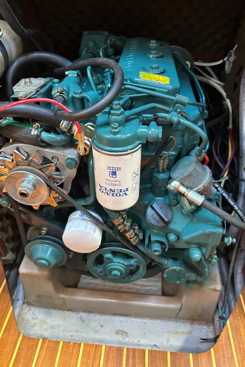 Slide: The Image of Engine of a 1986 Beneteau First 375 sailboat, showcasing detailed components. - 19
