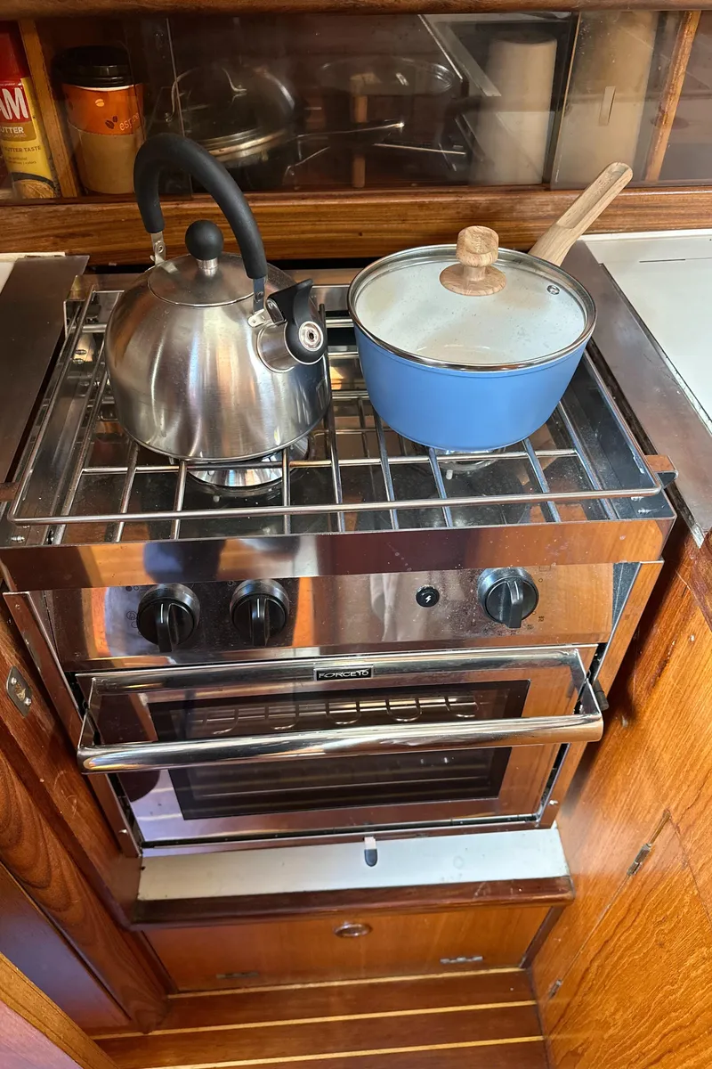 Slide: The Image of Stainless steel stove with kettle and pot in 1986 Beneteau First 375 yacht kitchen. - 20