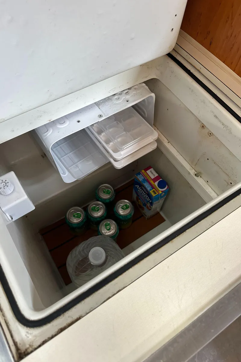 Slide: The Image of Built-in cooler on 1986 Beneteau First 375 yacht, stocked with drinks and snacks. - 21