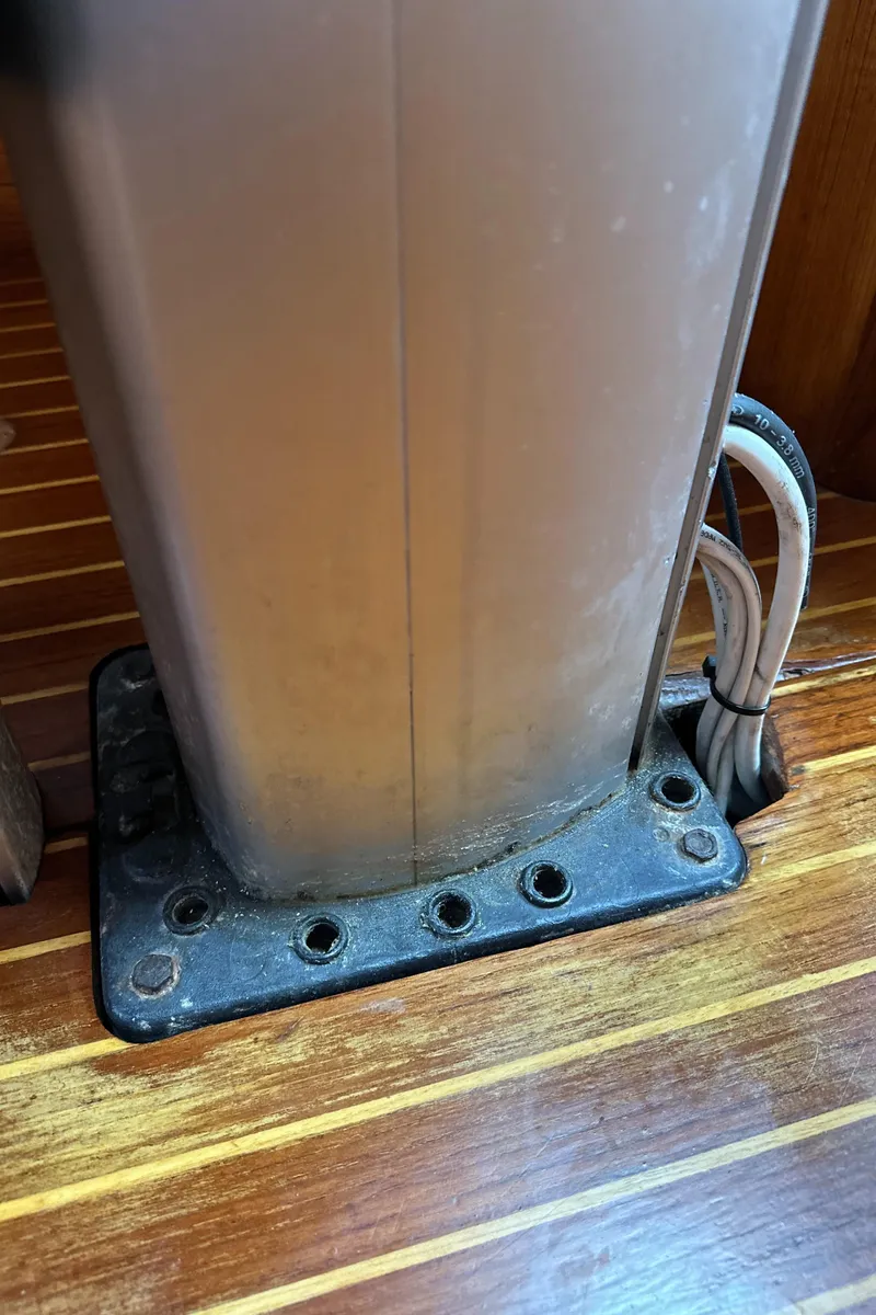 Slide: The Image of Mast base on 1986 Beneteau First 375 sailboat with visible wiring and wooden deck. - 22
