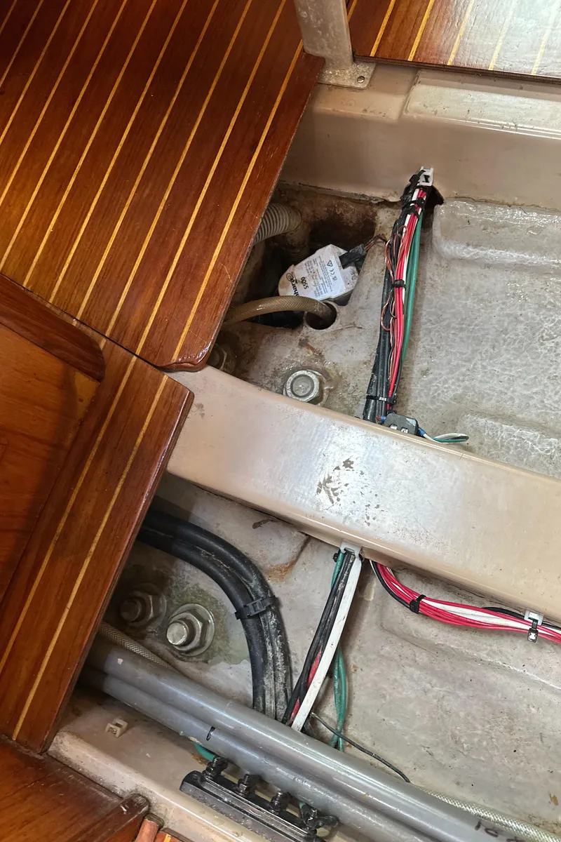 Slide: The Image of 1986 Beneteau First 375 interior wiring and flooring detail. - 23