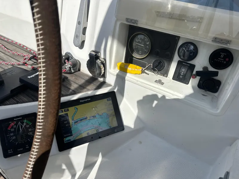 Slide: The Image of Cockpit of 1986 Beneteau First 375 sailboat with navigation instruments and steering wheel. - 8