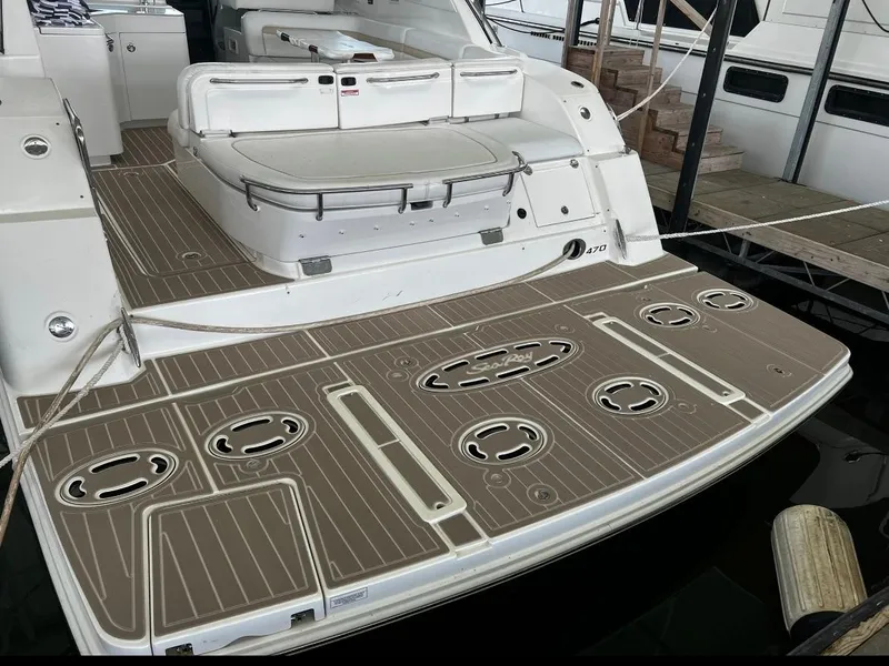 Slide: The Image of 2009 Sea Ray 470 Sundancer yacht with spacious deck and seating area. - 12