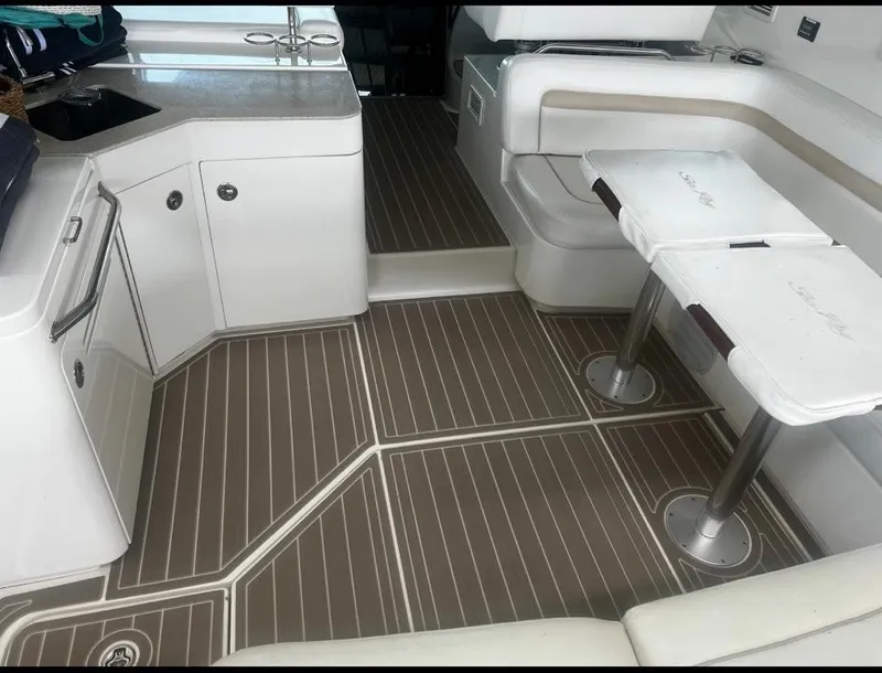 Slide: The Image of 2009 Sea Ray 470 Sundancer interior with sleek seating and modern design. - 13