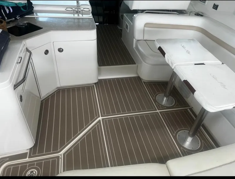 Slide: The Image of 2009 Sea Ray 470 Sundancer interior with sleek seating and modern design. - 14