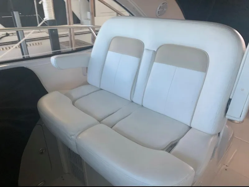 Slide: The Image of Luxury seating on 2009 Sea Ray 470 Sundancer yacht, featuring plush white upholstery. - 5