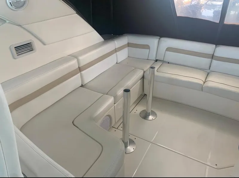 Slide: The Image of 2009 Sea Ray 470 Sundancer interior with white leather seating and modern design. - 6