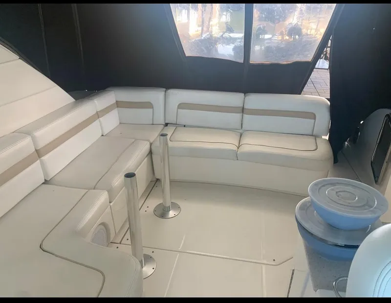 Slide: The Image of Luxurious interior of 2009 Sea Ray 470 Sundancer yacht with white seating. - 7