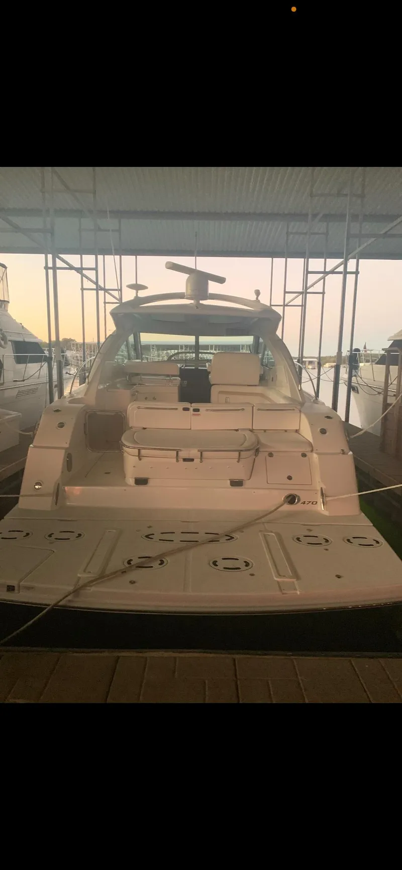 Slide: The Image of 2009 Sea Ray 470 Sundancer yacht docked in marina, rear view. - 9