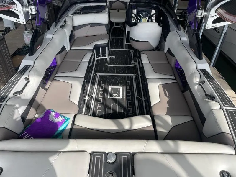 Slide: The Image of 2019 Centurion Fi25 boat interior with spacious seating and modern design. - 12