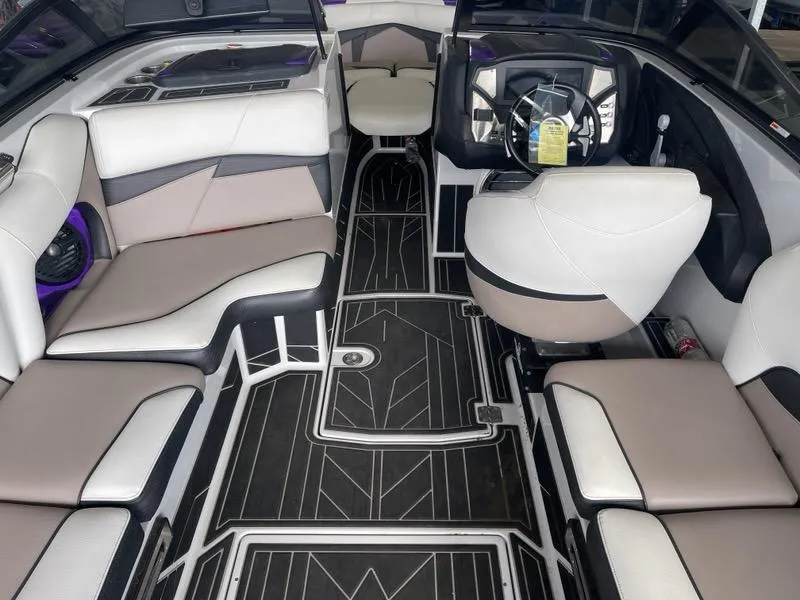 Slide: The Image of Interior of a 2019 Centurion Fi25 boat with modern seating and sleek design. - 13
