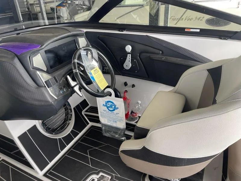 Slide: The Image of 2019 Centurion Fi25 boat interior with modern dashboard and steering wheel. - 15