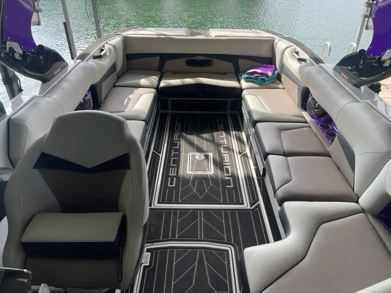 Slide: The Image of 2019 Centurion Fi25 boat interior with spacious seating and modern design. - 16