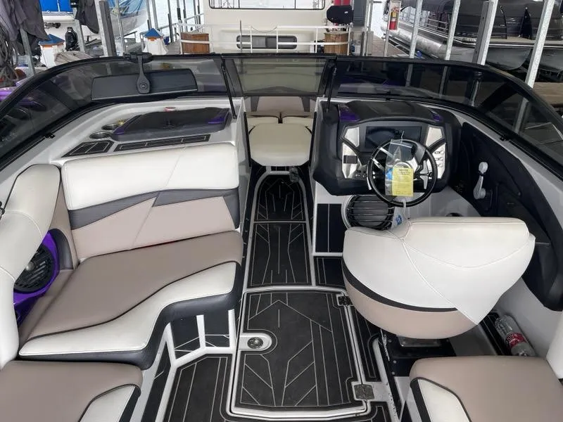 Slide: The Image of 2019 Centurion Fi25 boat interior with modern seating and sleek dashboard design. - 17