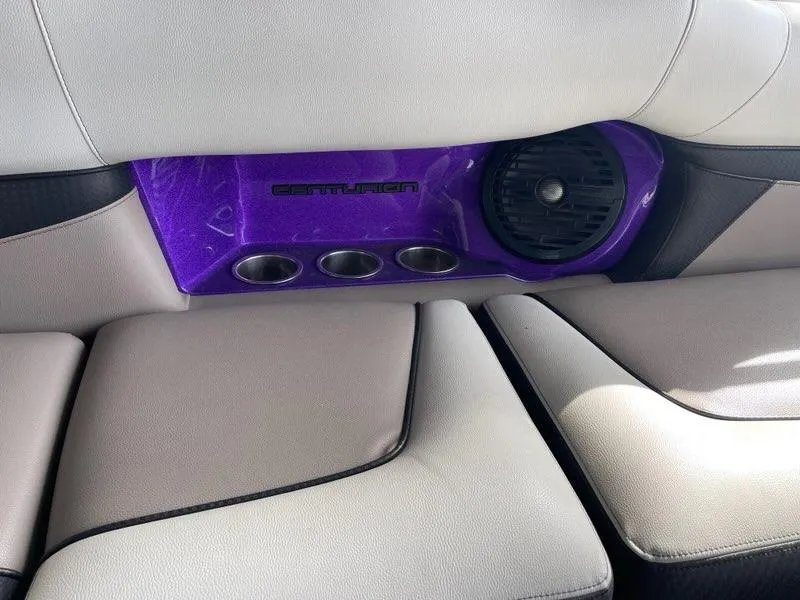 Slide: The Image of 2019 Centurion Fi25 interior with purple speaker panel and cup holders. - 18