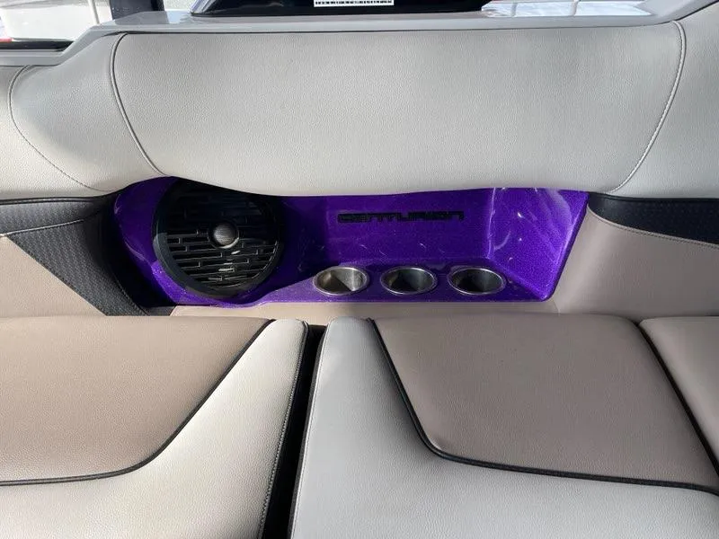 Slide: The Image of Interior of 2019 Centurion Fi25 boat with speaker and cup holders. - 19