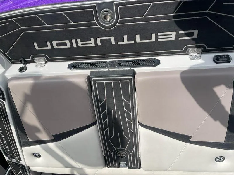 Slide: The Image of 2019 Centurion Fi25 boat deck with sleek black and gray design. - 21