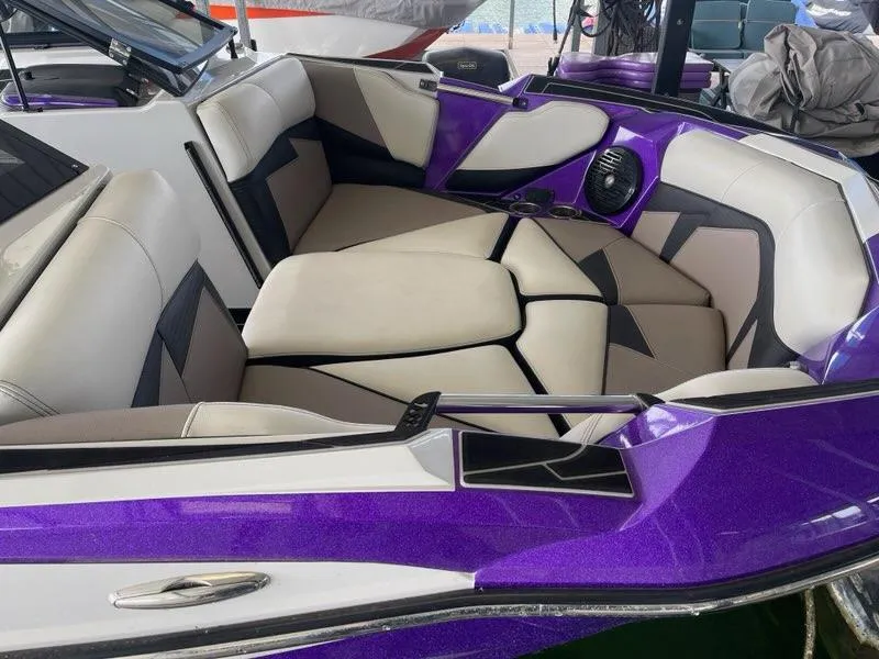 Slide: The Image of 2019 Centurion Fi25 boat interior with purple and beige seating. - 9
