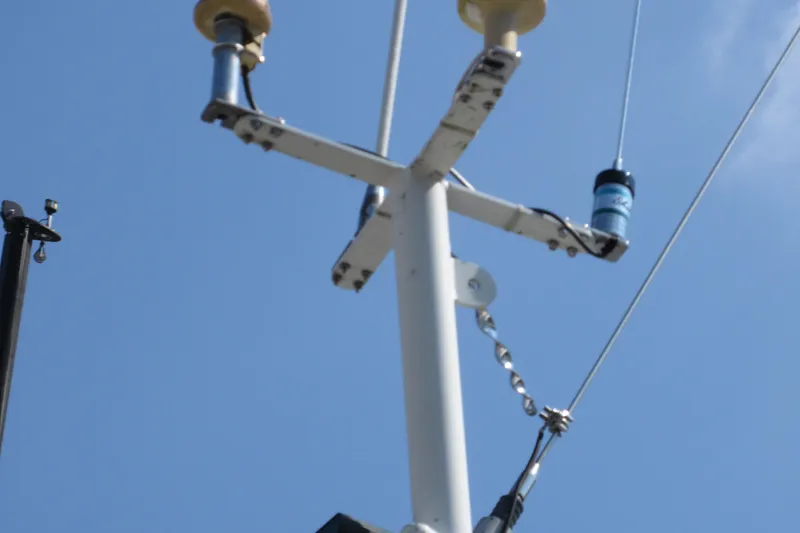 Slide: The Image of Mast of 1992 Valiant 40 sailboat against clear blue sky. - 11