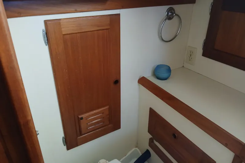Slide: The Image of Interior of 1992 Valiant 40 sailboat with wooden cabinetry and countertop. - 15
