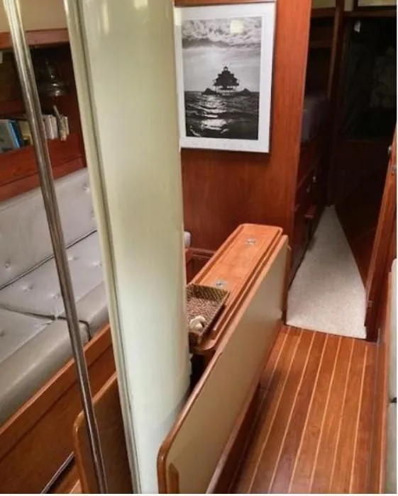 Slide: The Image of Interior of 1992 Valiant 40 yacht with wood paneling and nautical decor. - 20