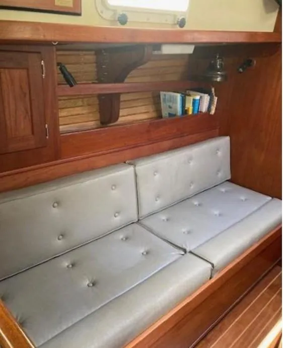 Slide: The Image of Interior of 1992 Valiant 40 sailboat with wooden cabinetry and cushioned seating. - 21