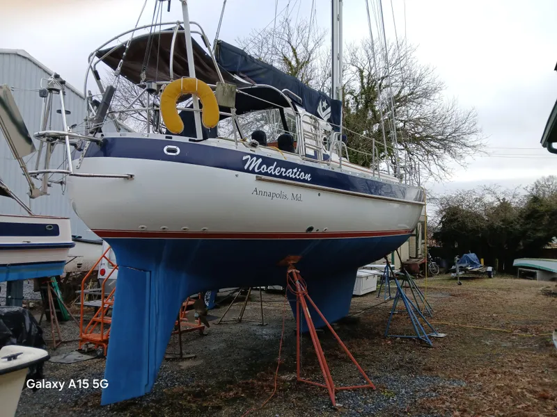 Slide: The Image of Valiant 40 sailboat from 1992 named "Moderation" in a boatyard, Annapolis, MD. - 4