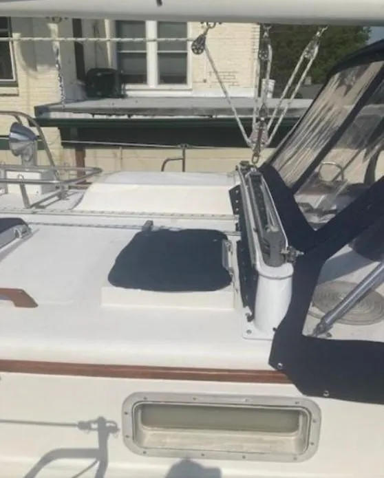 Slide: The Image of 1992 Valiant 40 sailboat deck with blue canvas cover and rigging. - 6