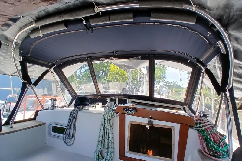 Slide: The Image of Cockpit of a 1992 Valiant 40 sailboat with ropes and canopy. - 7