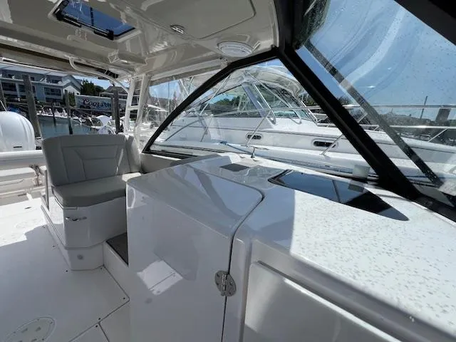 Slide: The Image of Interior of a 2019 Everglades 340 Dual Console boat, featuring sleek seating and modern design. - 10