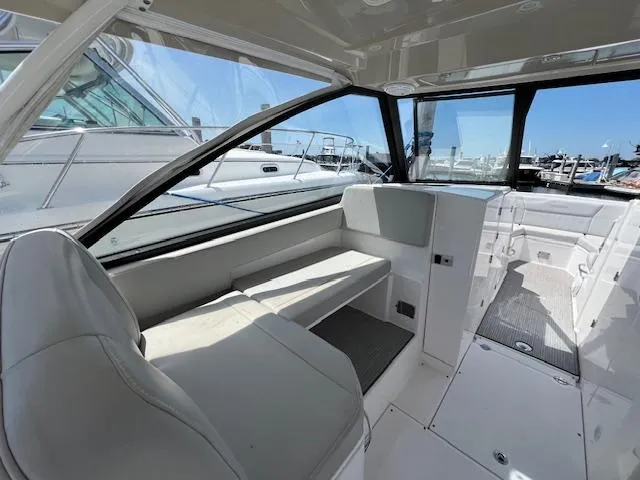 Slide: The Image of Interior of 2019 Everglades 340 Dual Console boat, featuring spacious seating and modern design. - 12